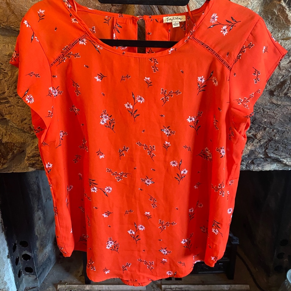 Orange top with white flowers. Large